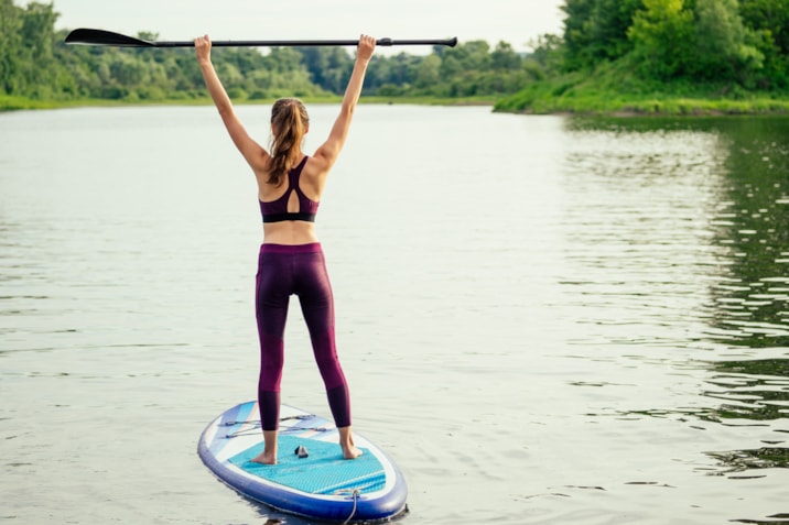 woman-on-sup-sup-board-in-nature-at-evening-2022-04-08-13-11-59-utc