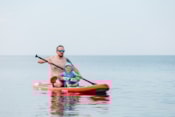 dad-and-son-sail-on-sup-board-on-the-sea-2022-11-11-08-47-40-utc
