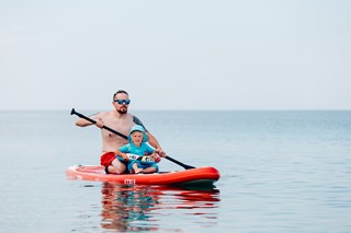 dad-and-son-sail-on-sup-board-on-the-sea-2022-11-11-08-47-40-utc